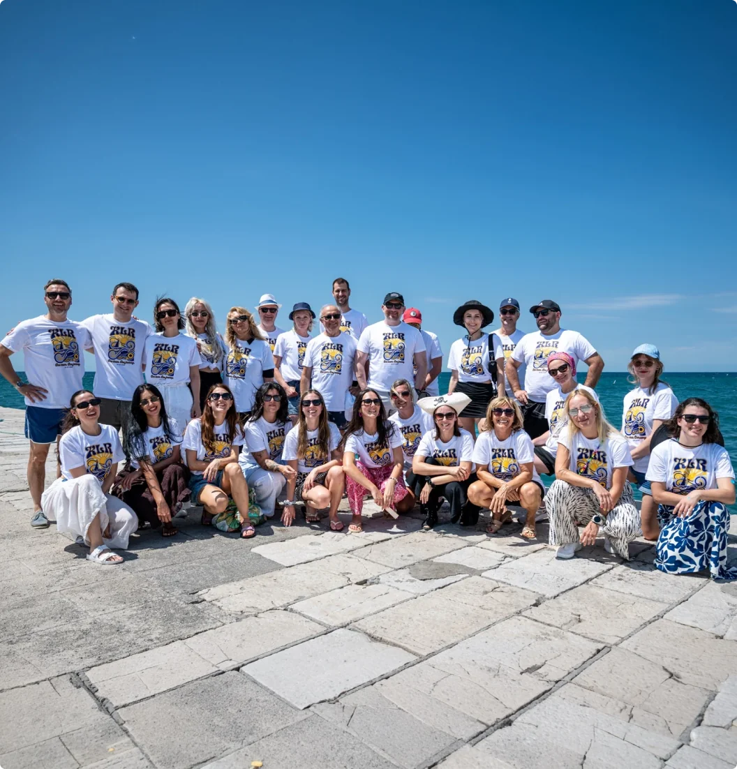 The KLR Europe team on a seaside pier, in matching KLR T-shirts